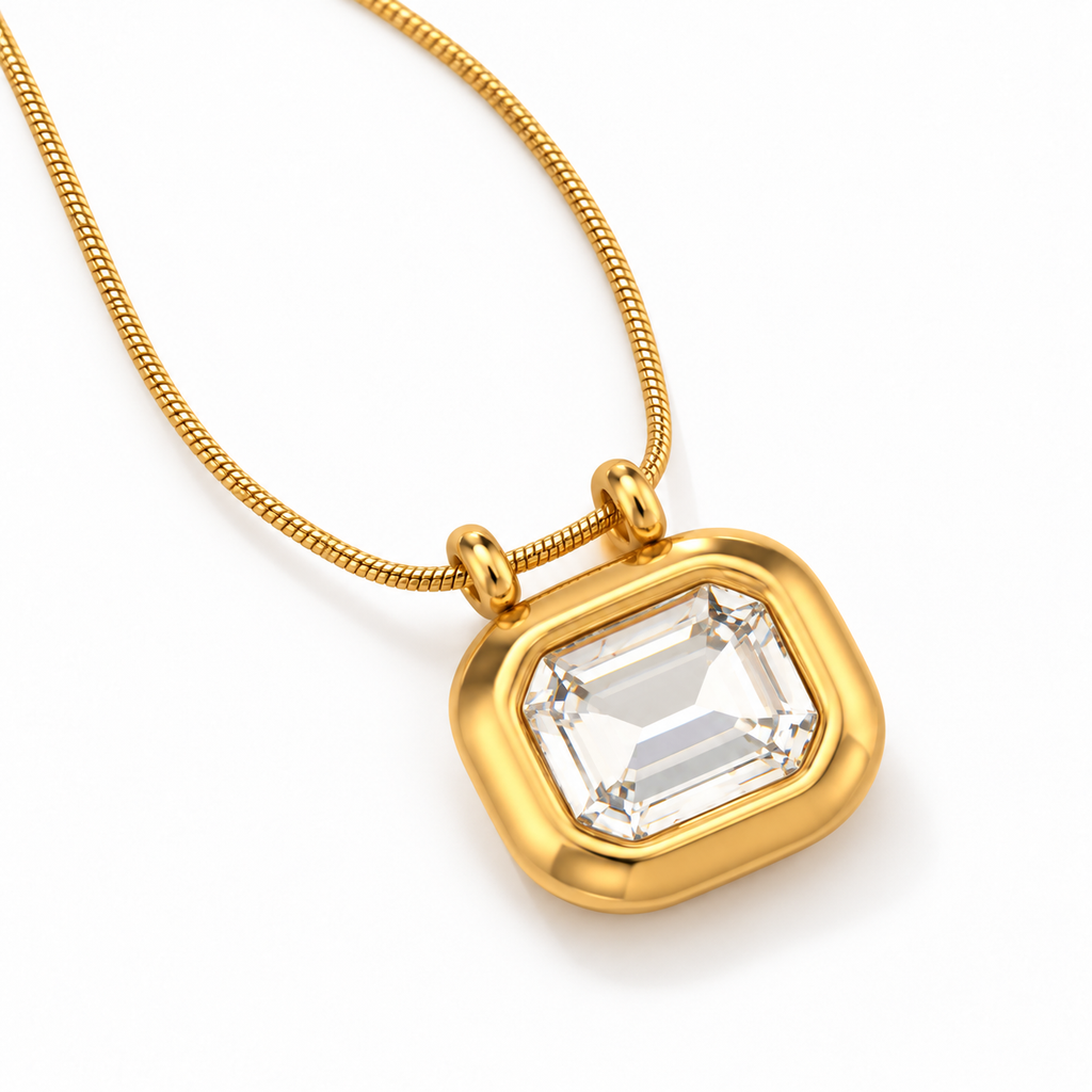 Gold-plated Sarnai necklace featuring a clear emerald-cut zirconia pendant on an adjustable chain