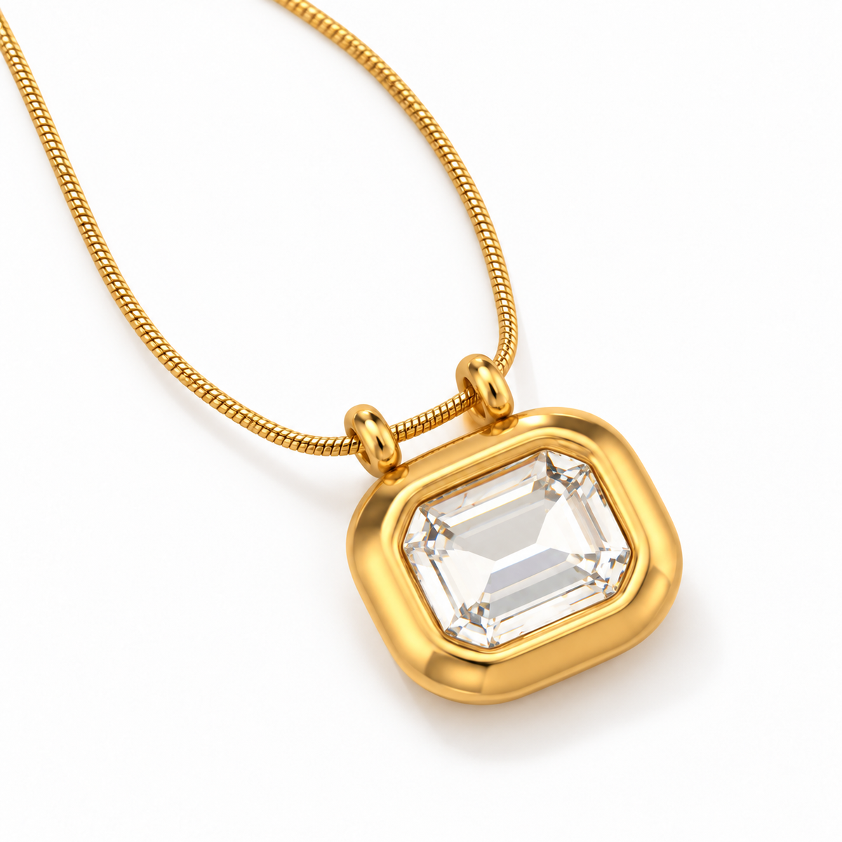 Gold-plated Sarnai necklace featuring a clear emerald-cut zirconia pendant on an adjustable chain