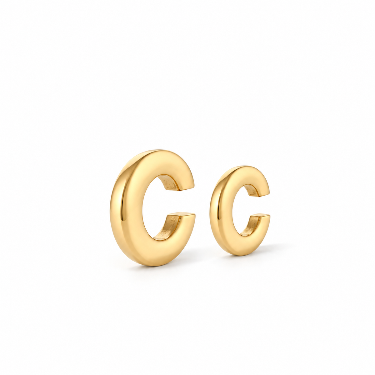 Duo Ear Cuffs in 18k gold-plated steel, shown in two sizes with rounded polished bands