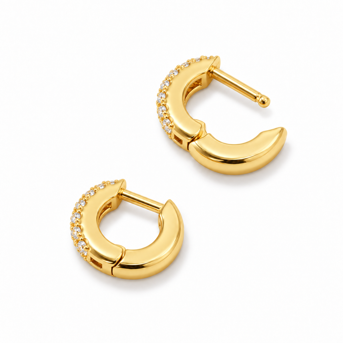 Compact 12 mm huggie hoops with rows of clear zirconia and a gold-plated finish