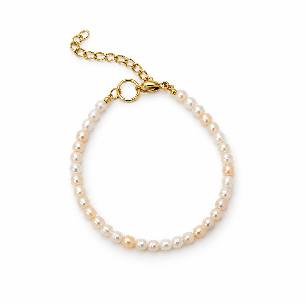 Rosario Pearl Bracelet with irregular white pearls, a gold-tone clasp and an adjustable extension chain